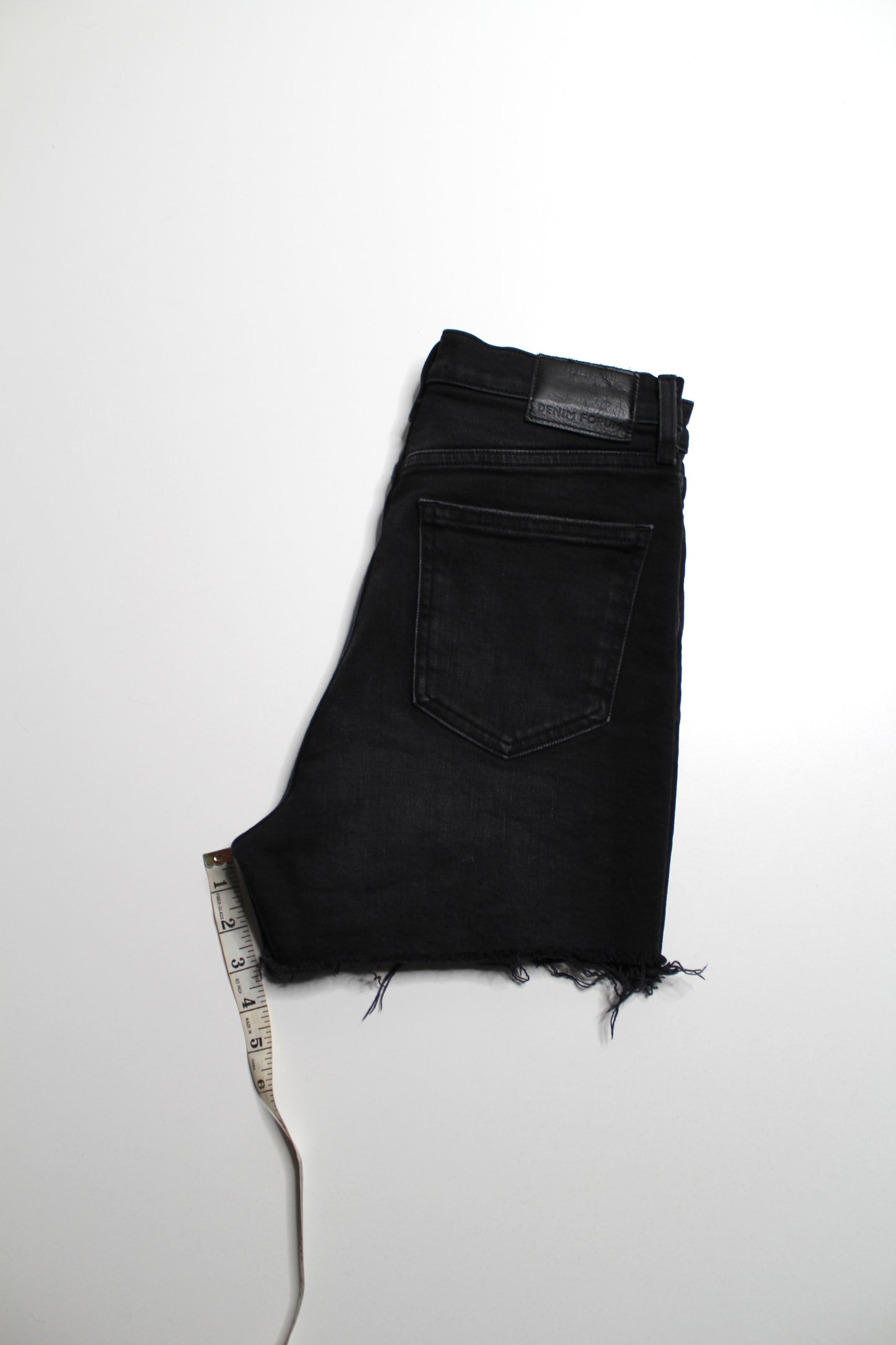 Aritzia Denim Forum black ’arlo’ cut off shorts, size 28