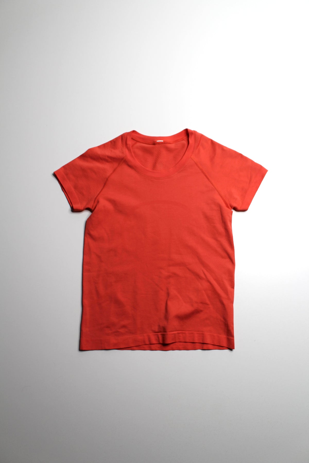 Lululemon orange ‘swiftly tech’ short sleeve, size 4