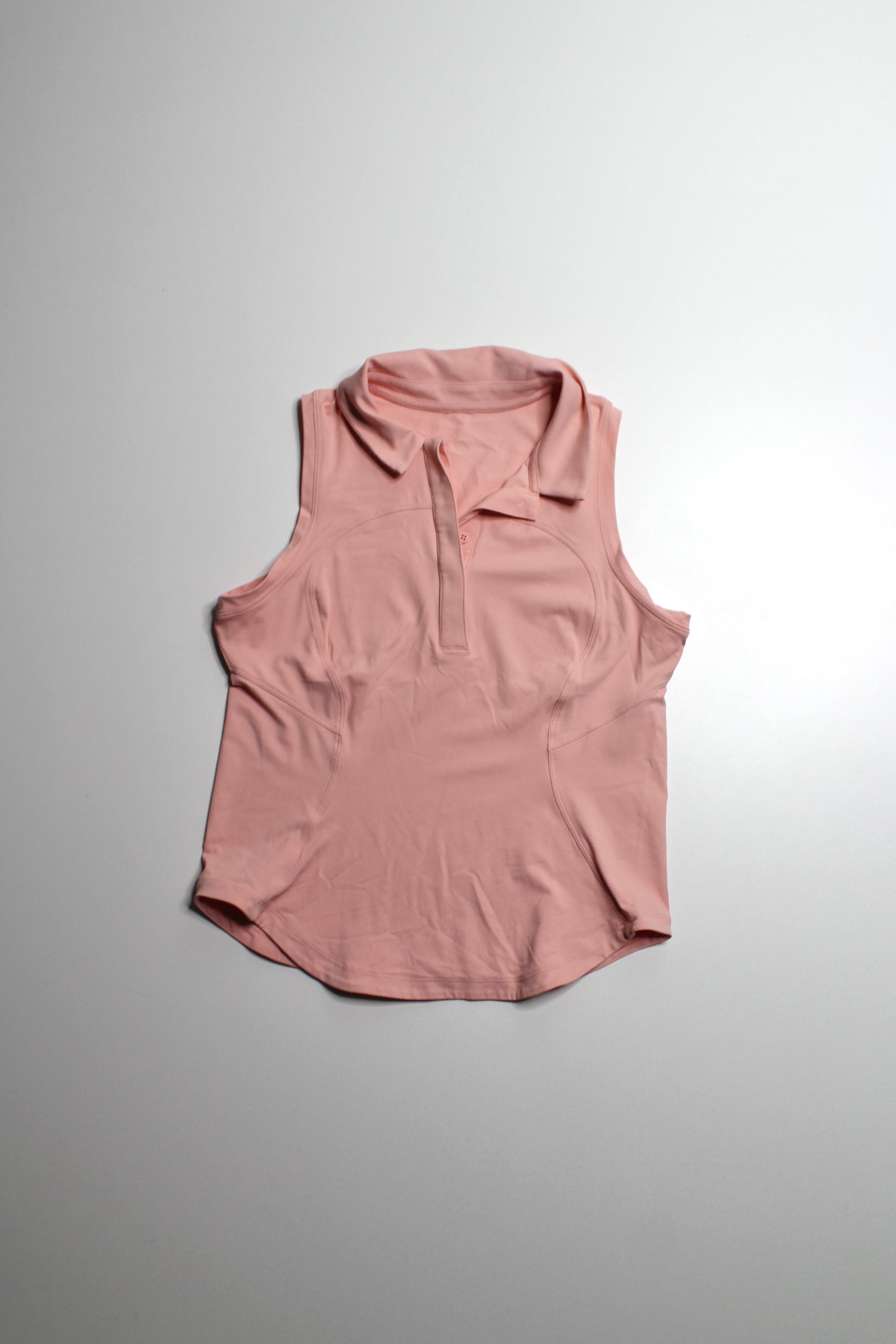 Lululemon coral ‘quick dry sleeveless polo' tank, no size. Fits like small *curved hem (fits 4/6)