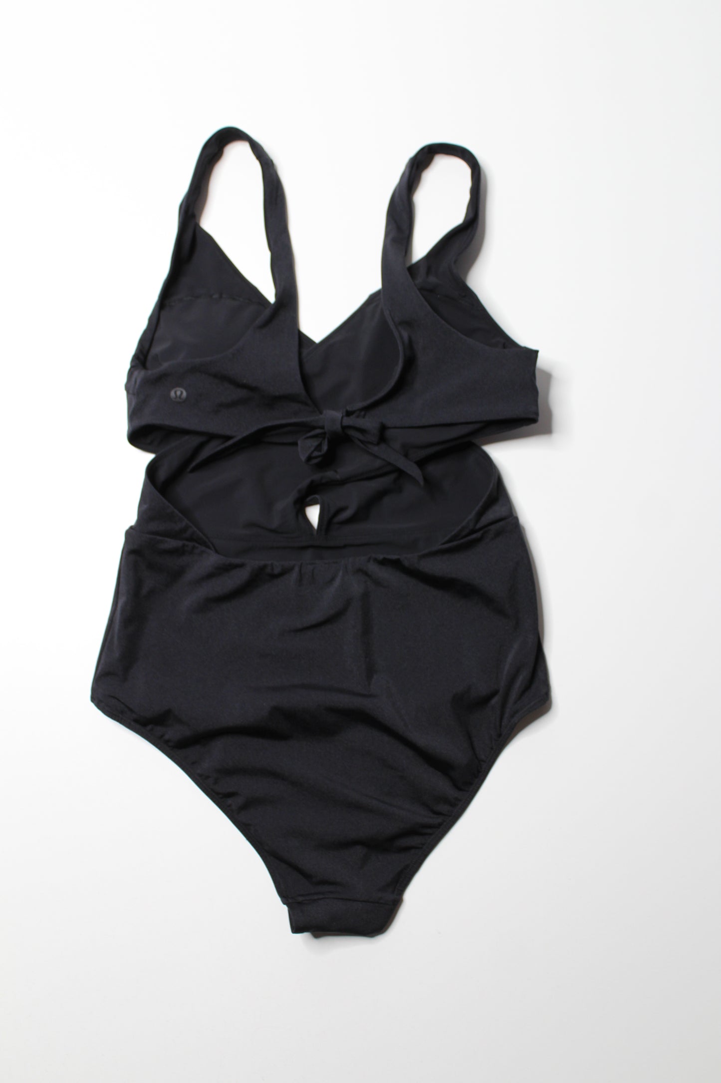 Lululemon black ‘all that glimmers wrap one piece swimsuit, no size. Fits like 8 (medium)