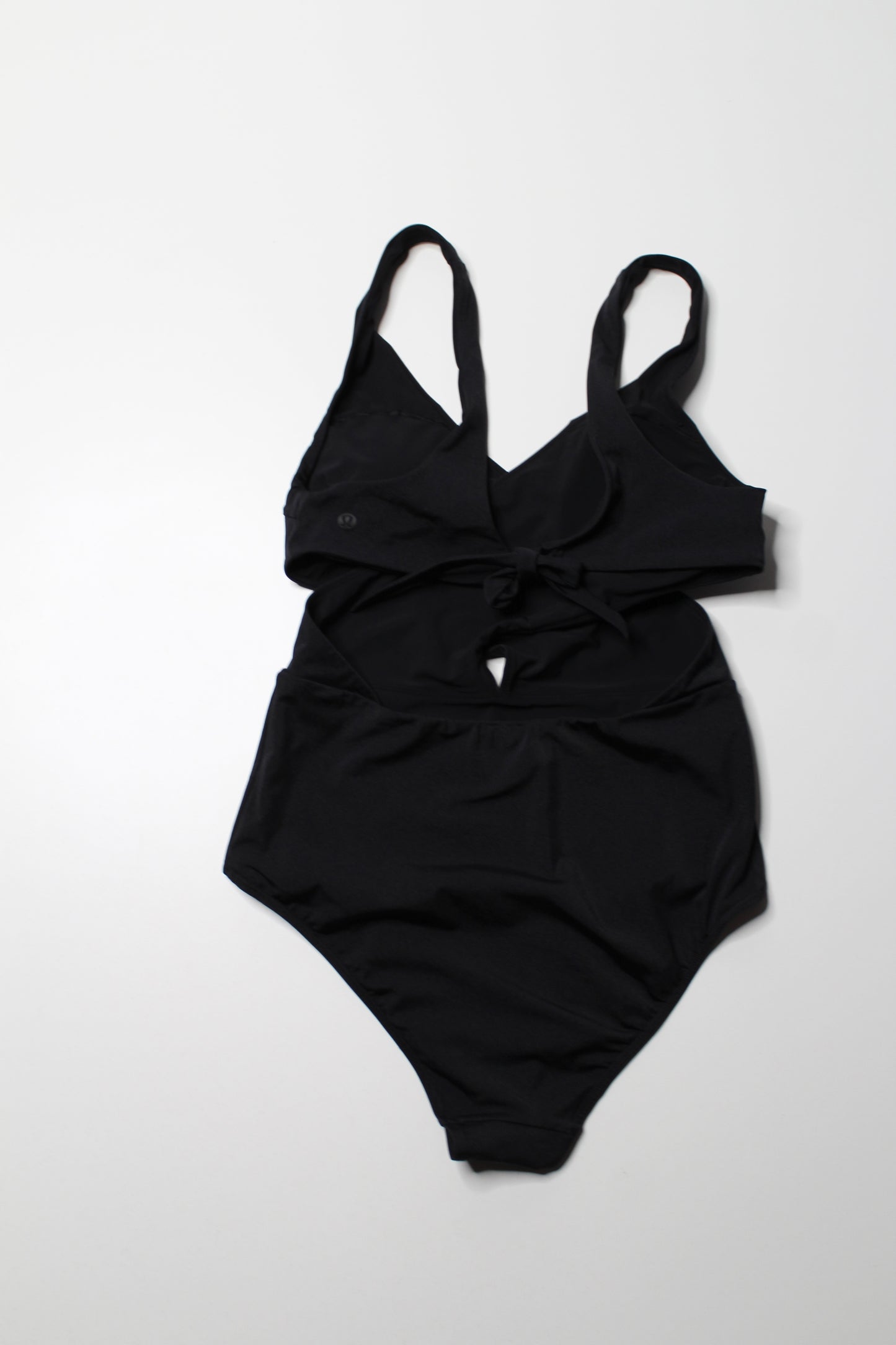 Lululemon black ‘all that glimmers wrap one piece swimsuit, no size. Fits like 8 (medium)