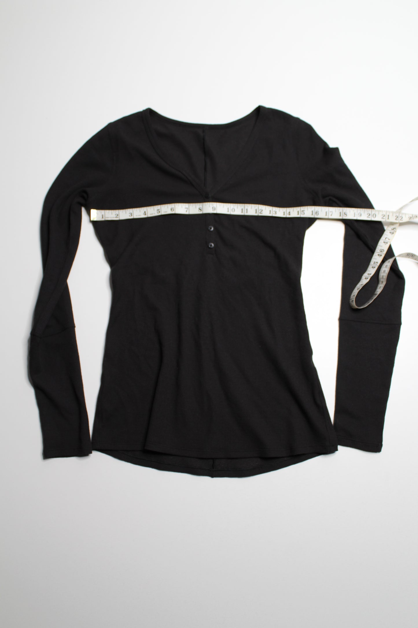 Lululemon black ‘close call’ henley long sleeve, no size. Fits like size small /size 6