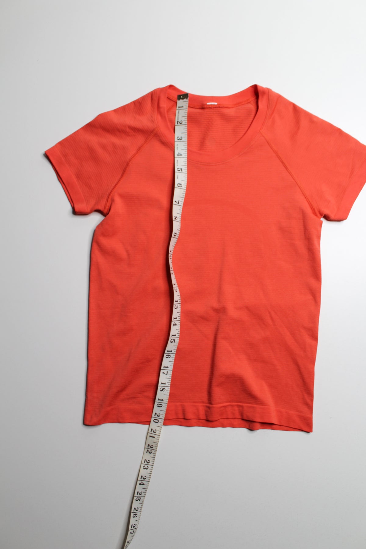 Lululemon orange ‘swiftly tech’ short sleeve, size 4