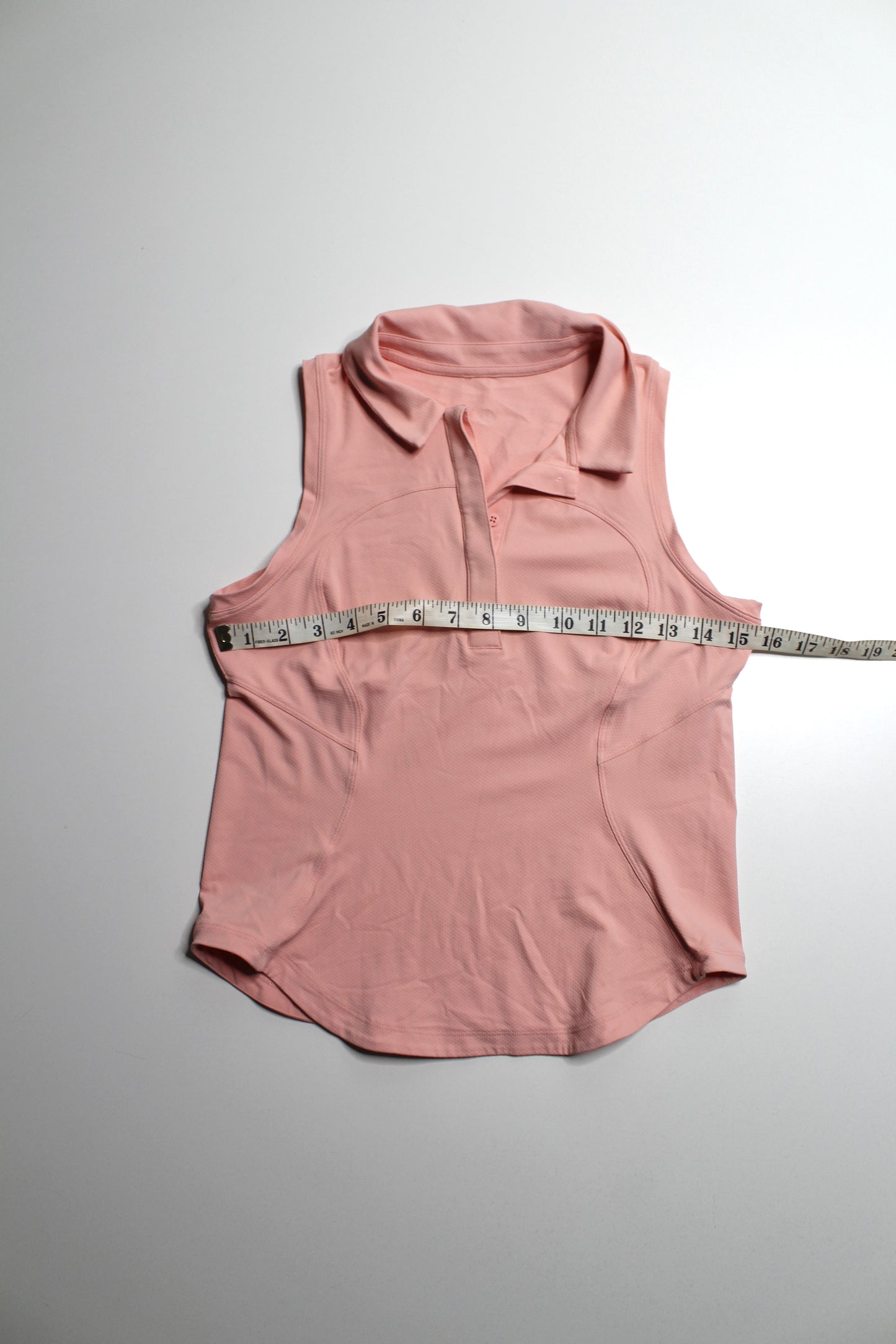 Lululemon coral ‘quick dry sleeveless polo' tank, no size. Fits like small *curved hem (fits 4/6)