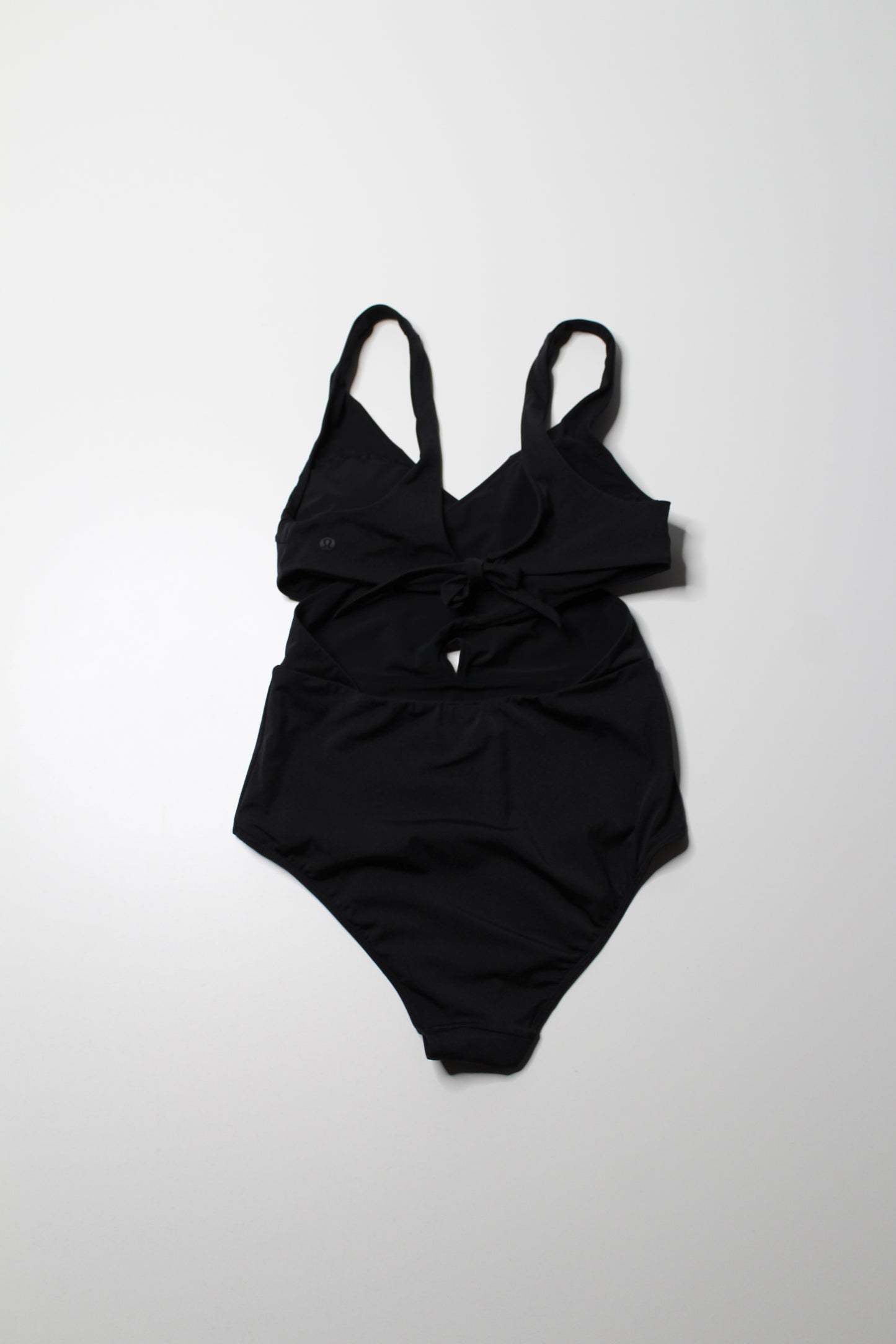 Lululemon black ‘all that glimmers wrap one piece swimsuit, no size. Fits like 8 (medium)