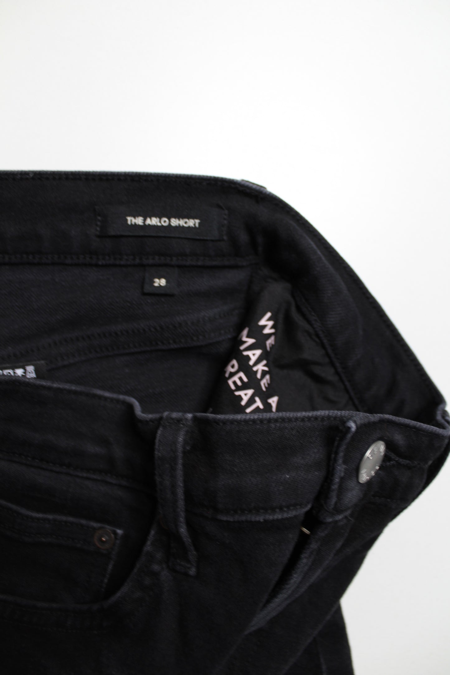 Aritzia Denim Forum black ’arlo’ cut off shorts, size 28