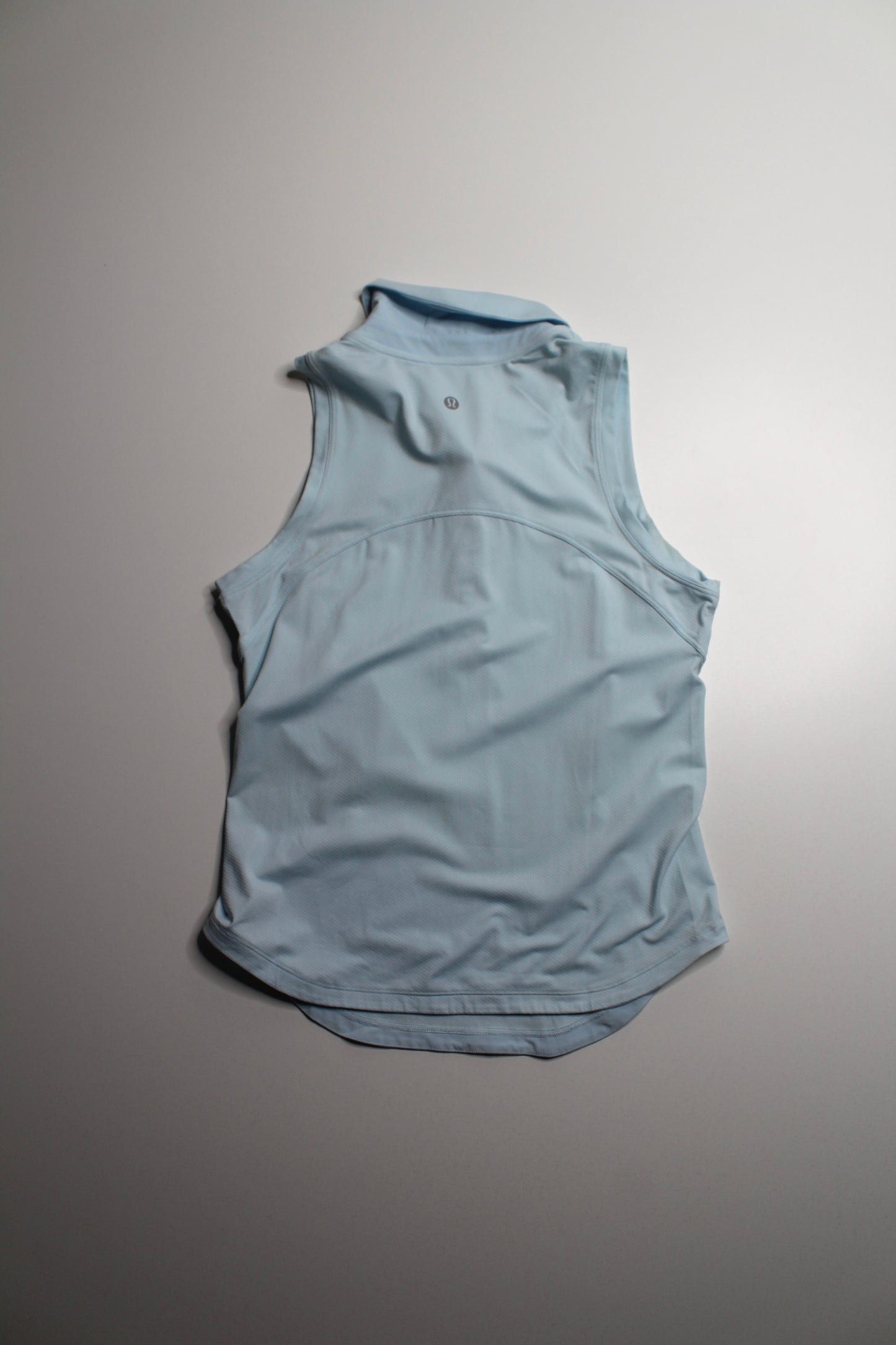 Lululemon light blue ‘quick dry sleeveless polo' tank, no size. Fits like 4 *curved hem