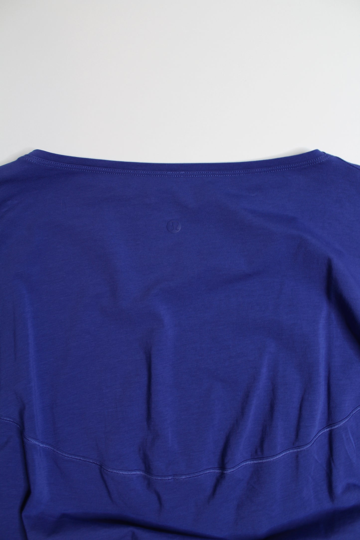 Lululemon blue back in action long sleeve, no size. Fits like size 6 (loose fit) (price reduced: was $36)