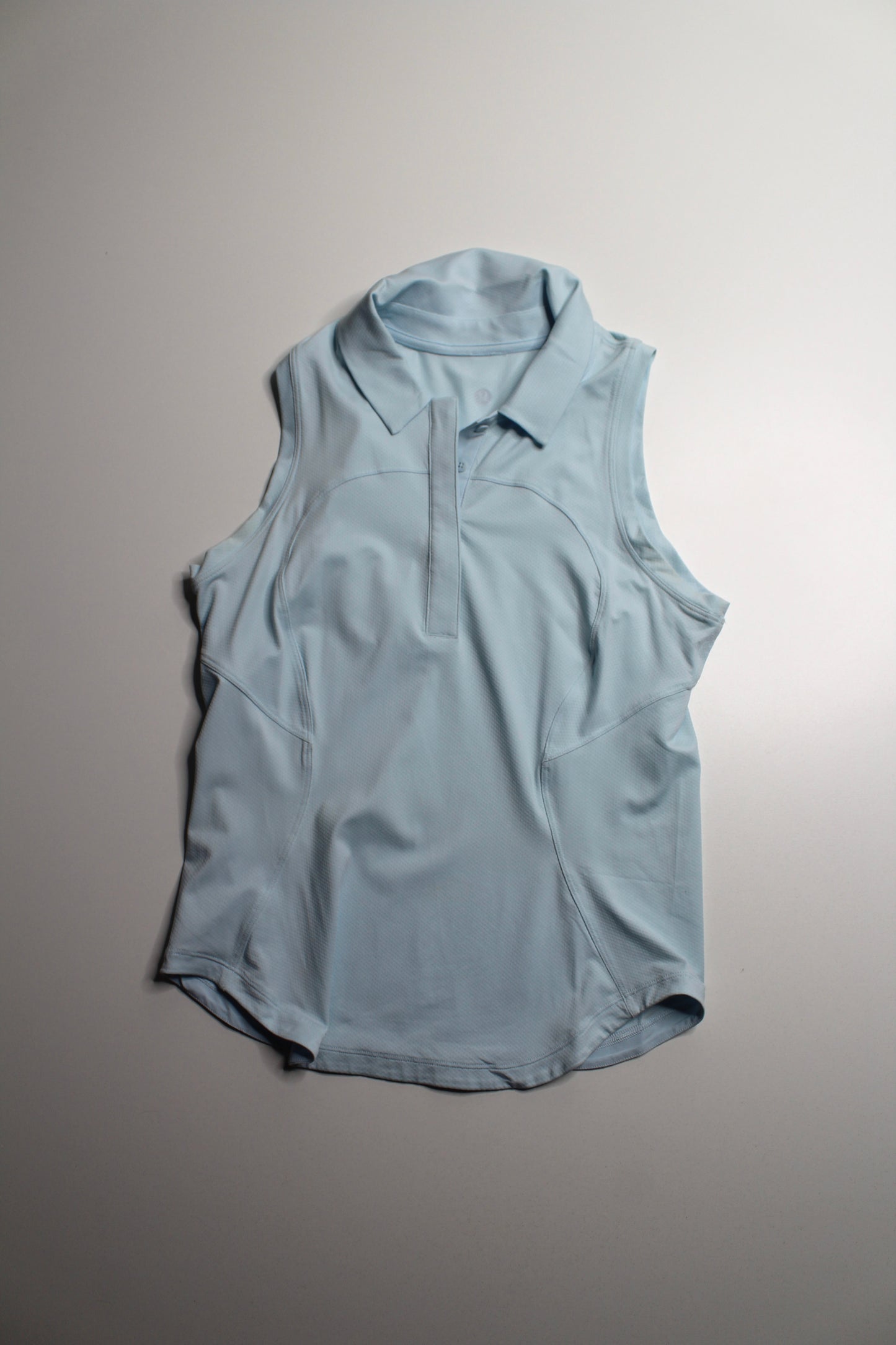 Lululemon light blue ‘quick dry sleeveless polo' tank, no size. Fits like 4 *curved hem