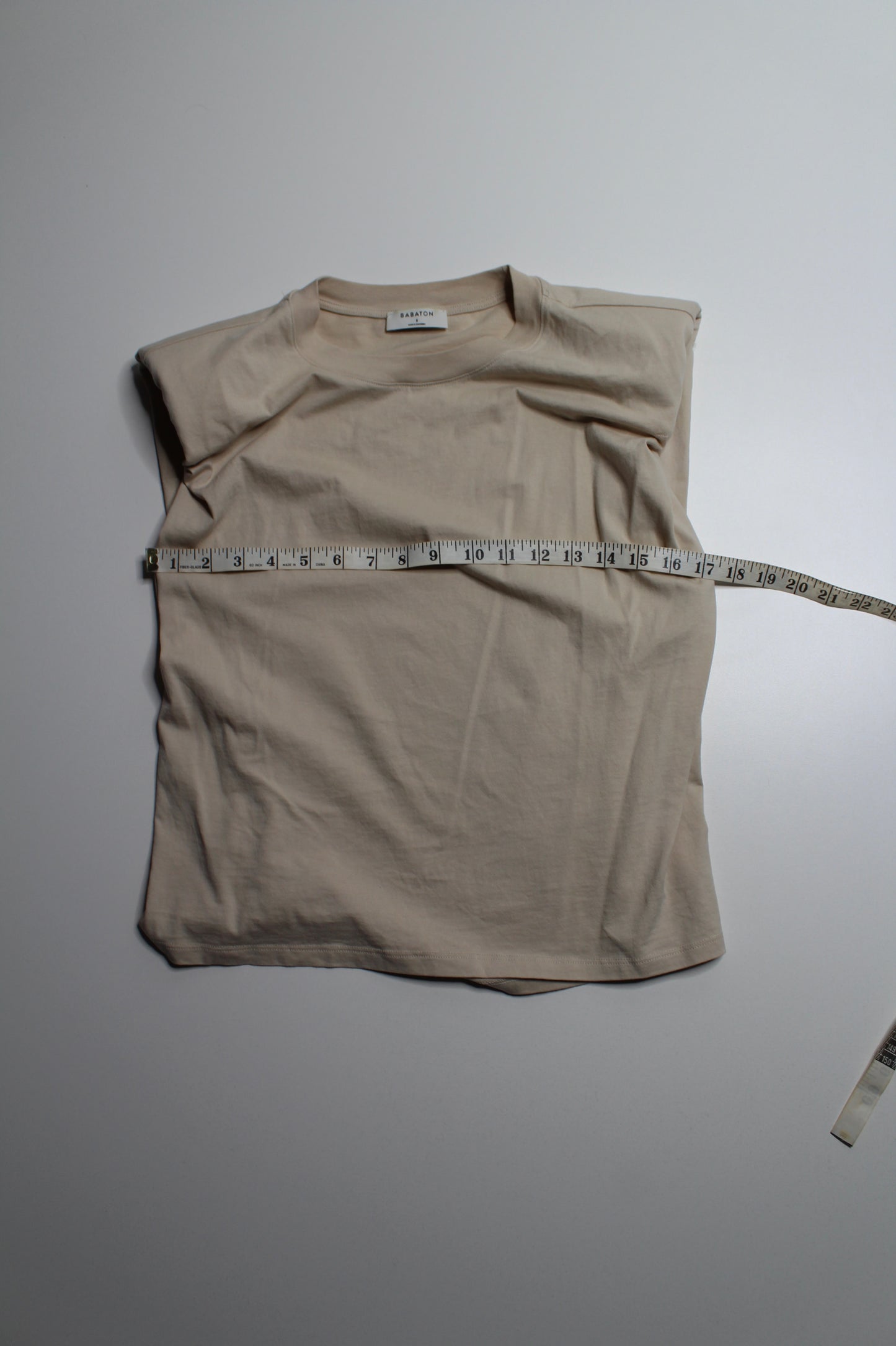 Aritzia tan shoulder pad sleeveless t shirt, size small