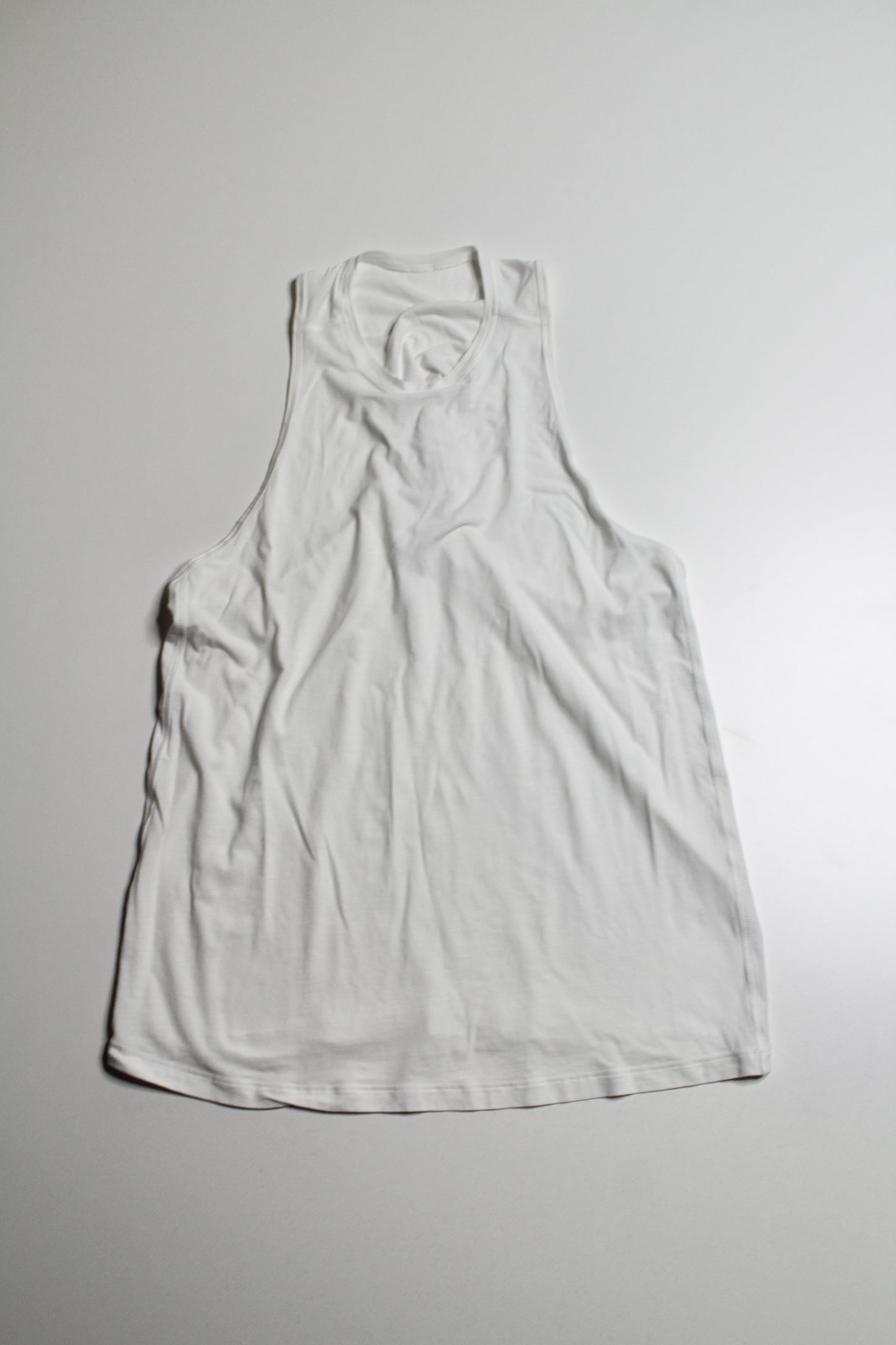 Lululemon white high neck twist back tank, no size. fits like 6