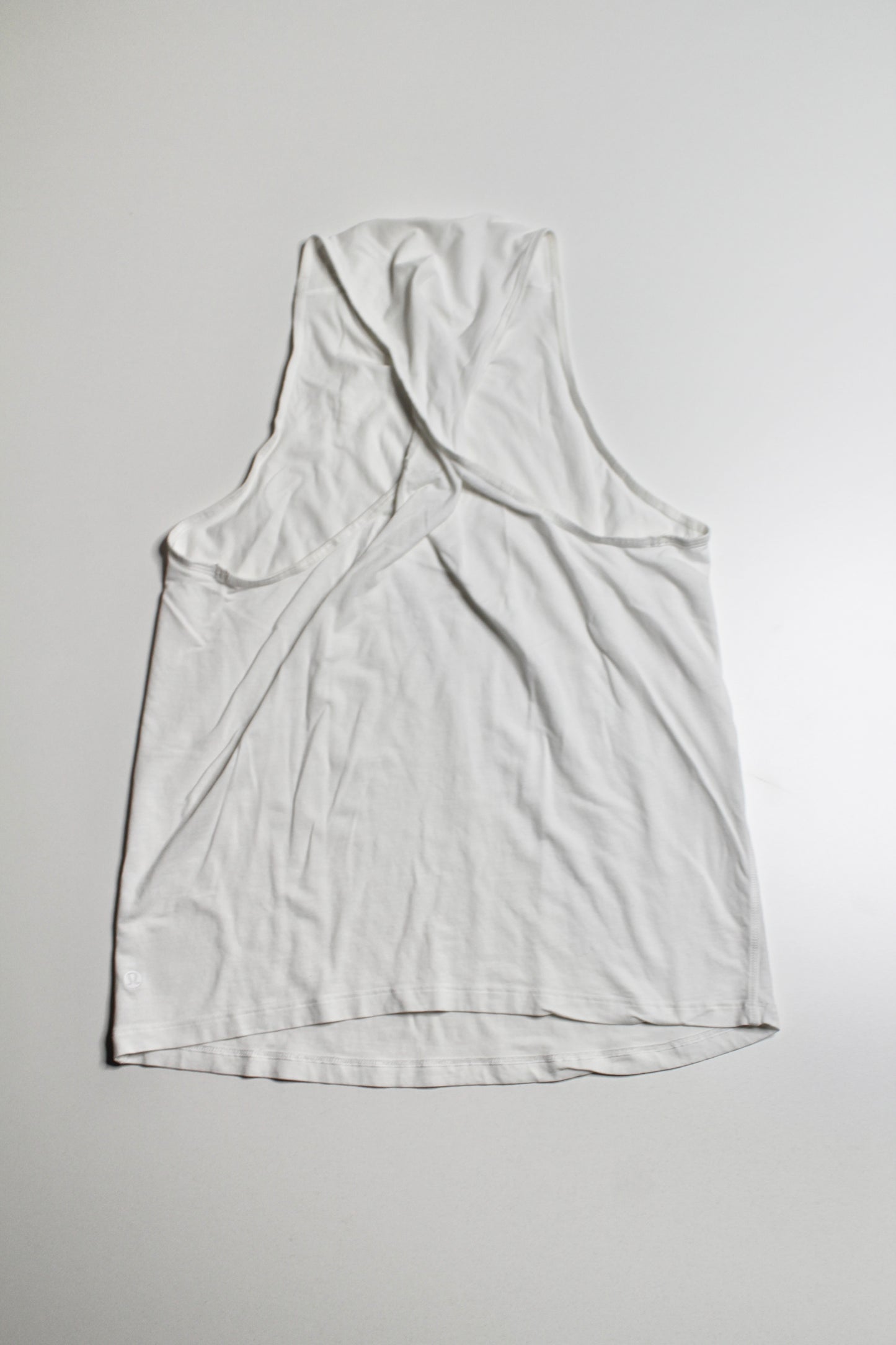 Lululemon white high neck twist back tank, no size. fits like 6