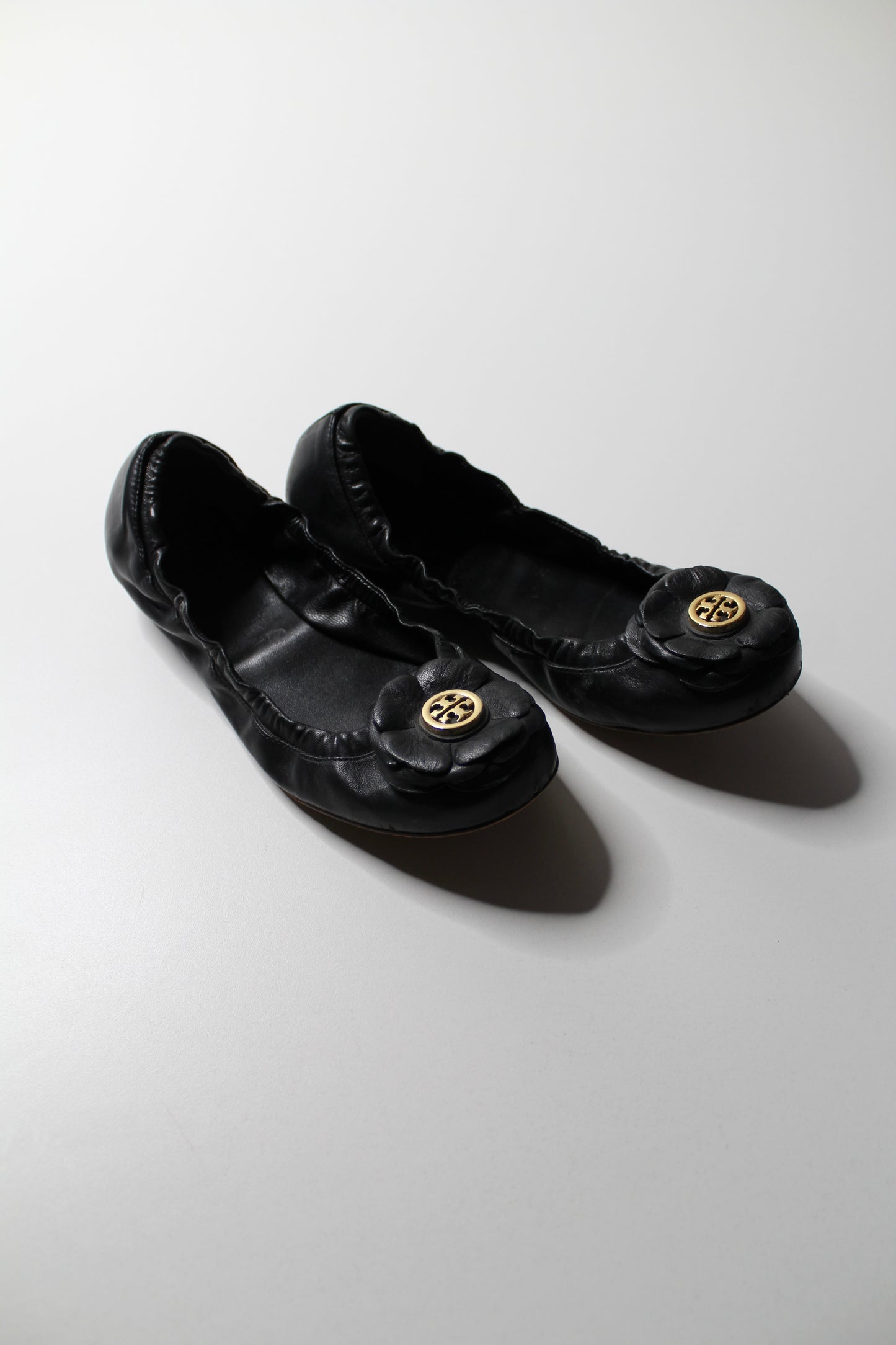 Tory Burch black ‘rose’ ballet flats, size 6.5