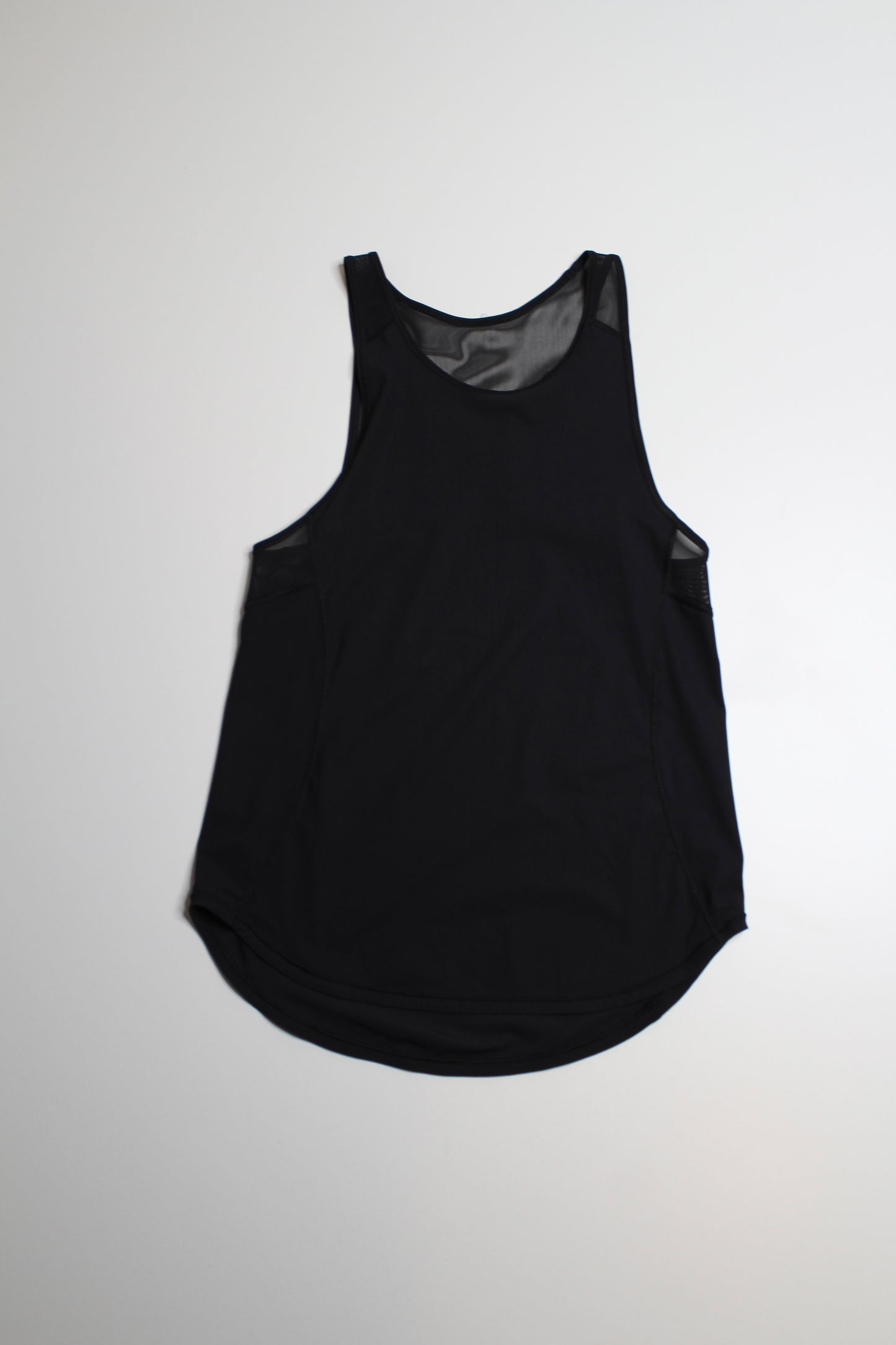 Lululemon black back sculpt tank, no size. Fits like size 2 (loose fit) Fits 2/4