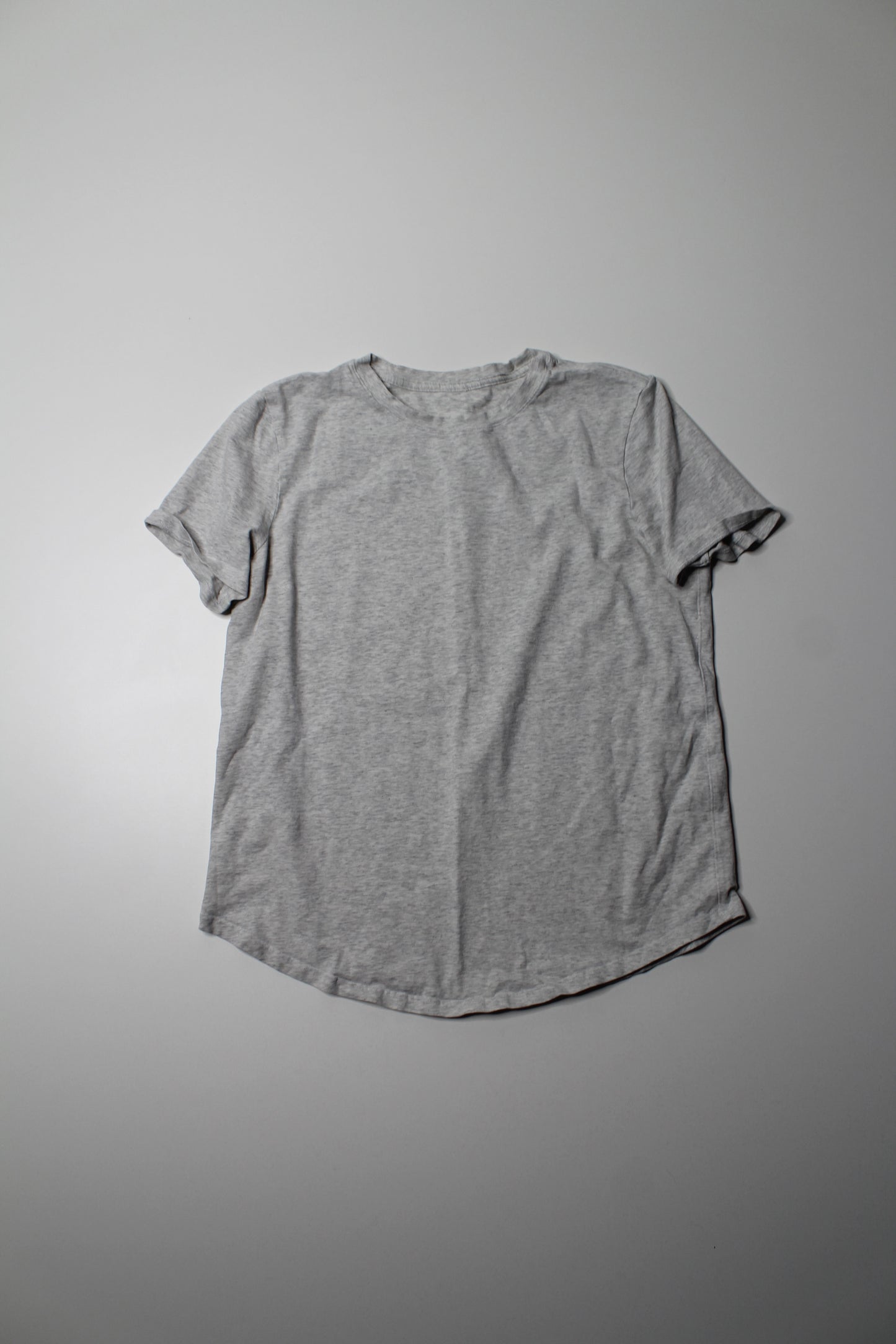 Lululemon heathered grey t shirt, no size. Fits like 6 (relaxed fit)