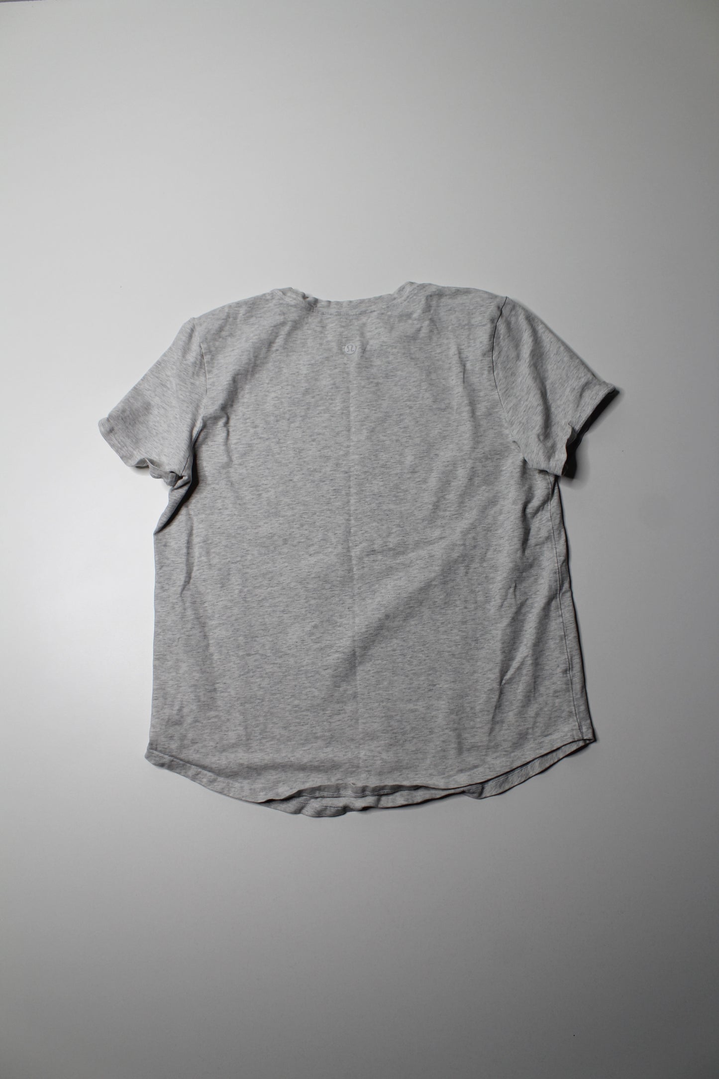 Lululemon heathered grey t shirt, no size. Fits like 6 (relaxed fit)