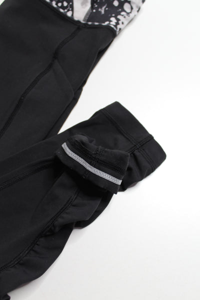 Lululemon black ruffle bottom reflective run tights, size 4 (price reduced: was $40)