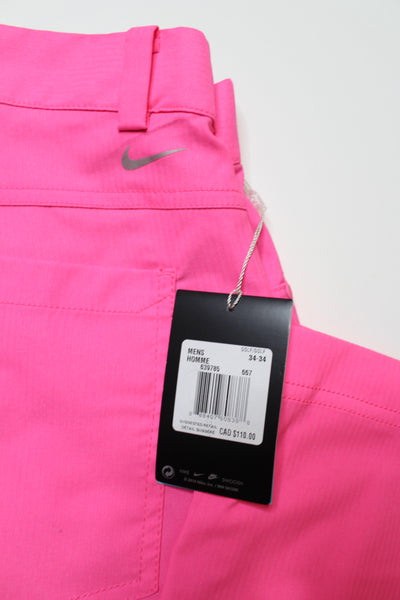 Mens Nike neon pink golf pant, size 34 *new with tags (price reduced: was $60)