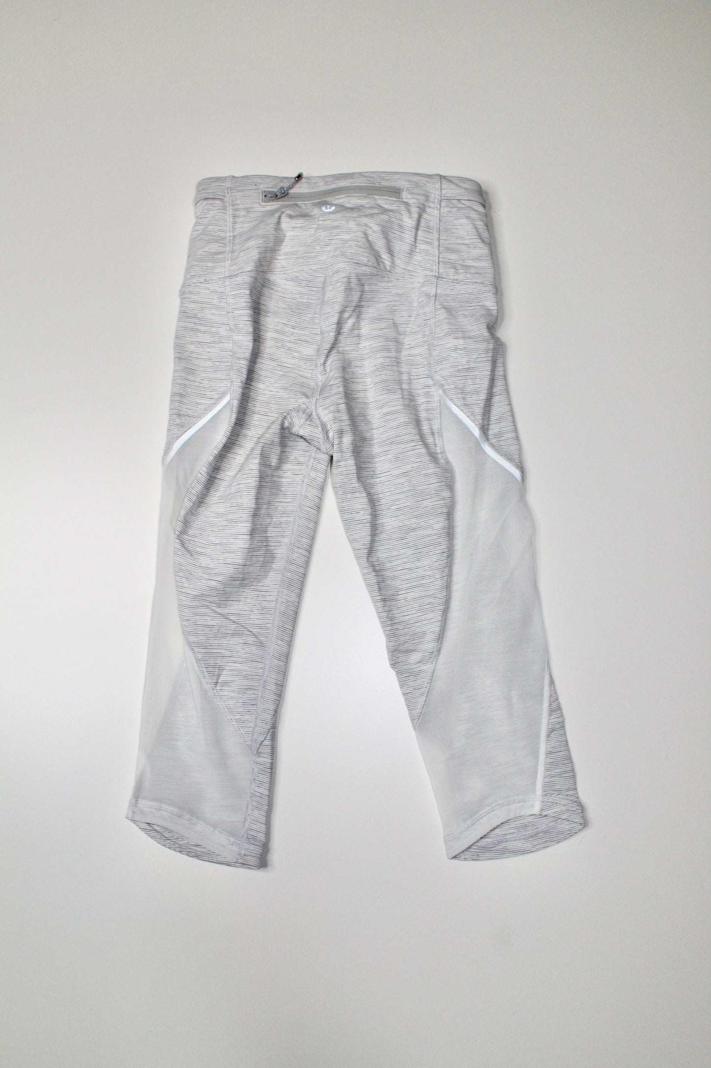 Lululemon we are from space battleship/white run with the sun crop, size 4 (15”) (price reduced: was $36)